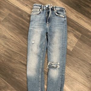 Distressed blue jeans